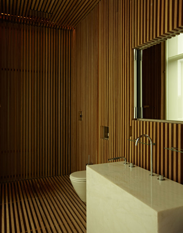 The pool bath at #MaisonMeadowlark. 360 degrees of wood paneling and a futuristic bespoke marble block sink.